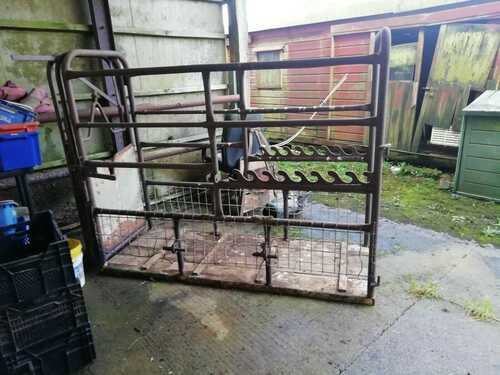 Cattle crush, wooden base, in used condition