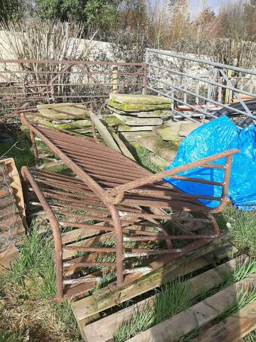 Large iron cattle feeders.